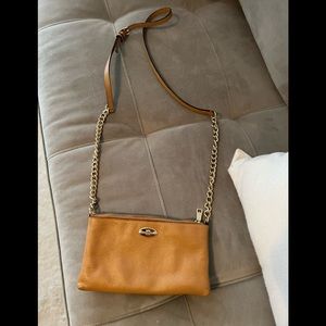 Tan and gold leather coach crossbody